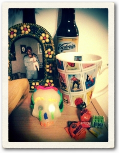 Altar with offering for Bertin Ventura, October 28th, 2012 (Mexican beer Victoria, chicken in green sauce tamale, sugar skull, hot chocolate cornmeal breakfast beverage, photograph in clay frame.) 